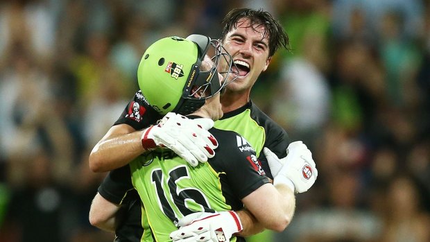 Nailbiter: Pat Cummins embraces Eoin Morgan after the Sydney Thunder's thrilling BBL win over the Melbourne Stars.