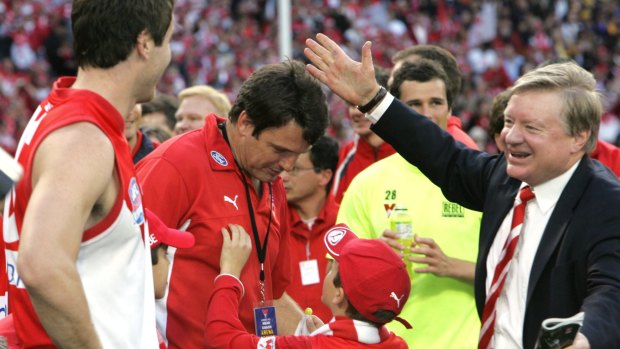 Champions: Richard Colless celebrates the Swans' 2005 premiership with Paul Roos.