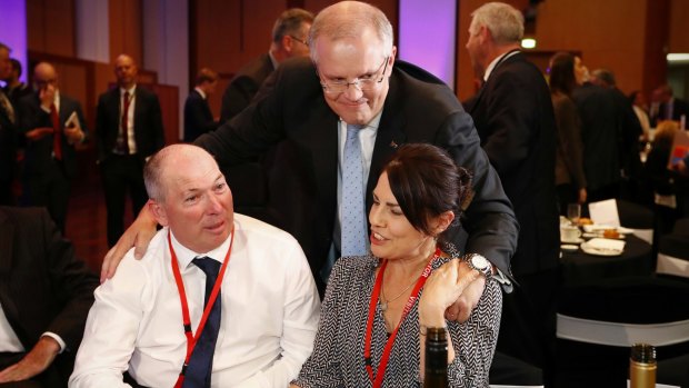 Treasurer Scott Morrison with his brother-in-law Gary Warren and his wife Michelle Warren.