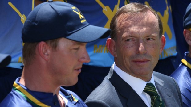 Prime Minister Tony Abbott, pictured at the PM's XI in Canberra on Wednesday, has defended his government's decision to cut the rebate.