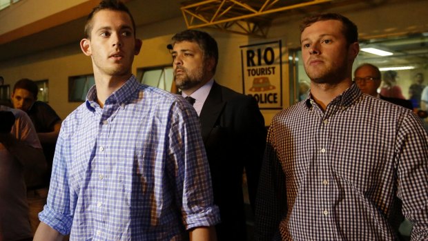 American Olympic swimmers Gunnar Bentz, left, and Jack Conger leave a Rio police station on Thursday. 