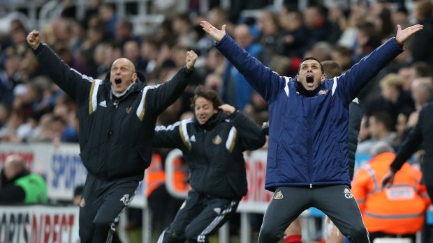 Victory: Sunderland's Uruguayan manager Gus Poyet (right) and coaches react to Adam Johnson's late winner.