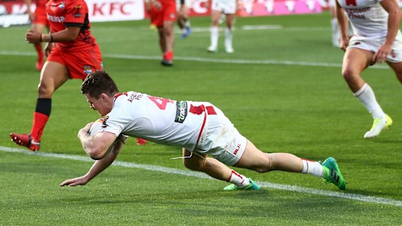 Early momentum: John Bateman crosses for England.