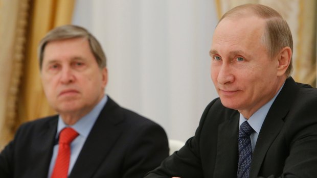 Russian President Vladimir Putin, right, and his foreign affairs adviser Yury Ushakov.