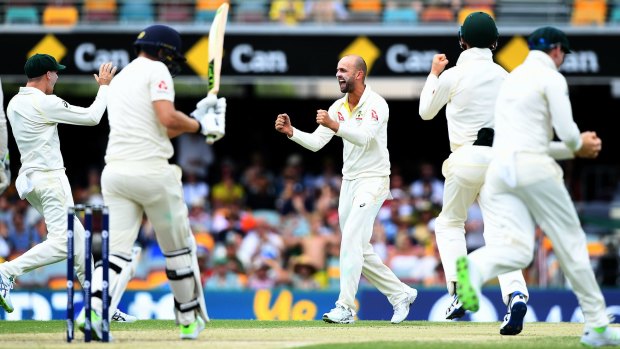 Hard to tame: Nathan Lyon celebrates after dismissing Dawid Malan for just four runs in the second innings at the Gabba.