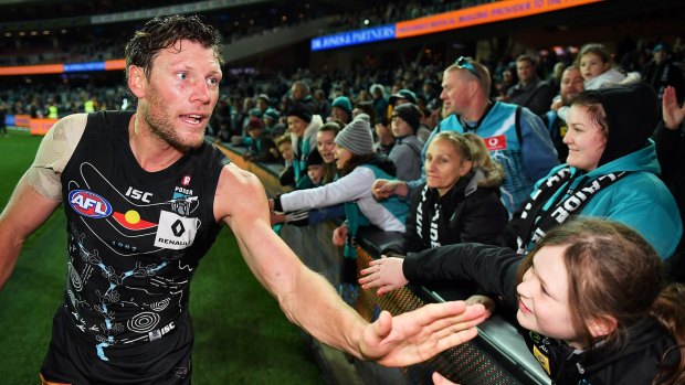 Fans help Brad Ebert mark his 200th game afer the win against Hawthorn. The players are in the game for love and the contract is a bonus, says Hinkley.
