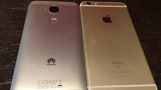 The backs of the Huawei G8 and iPhone 6s Plus.
