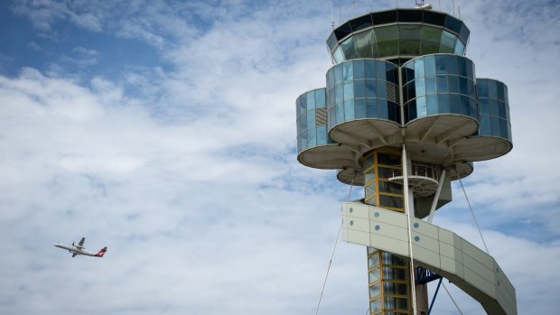 The tower at Sydney Airport.  Airservices Australia has proposed relocating as many as 65 air traffic controllers from Sydney to Melbourne, halving the number of controllers at Sydney Airport.