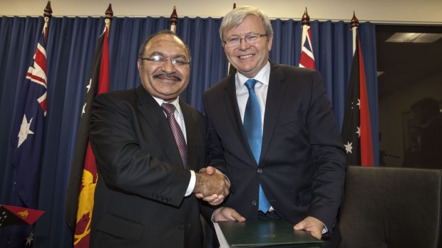 Papua New Guinea's Prime Minister Peter O'Neill and then Australian prime minister Kevin Rudd sign an agreement over asylum seekers in 2013.