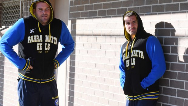 Keeping warm: Danny Wicks with Isaac De Gois at Eels training on Wednesday.