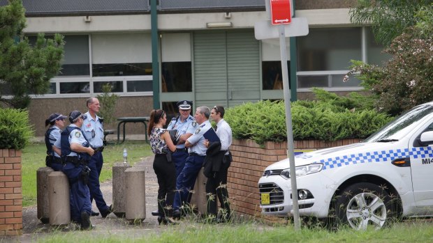 Police gather outside Woolooware High School, which also received a bomb threat.