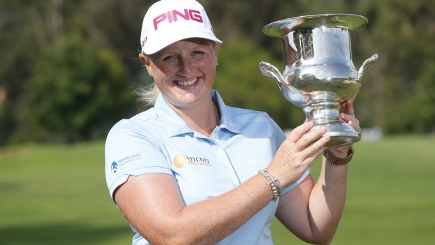 Triumphant: Holly Clyburn with the NSW Open golf trophy.