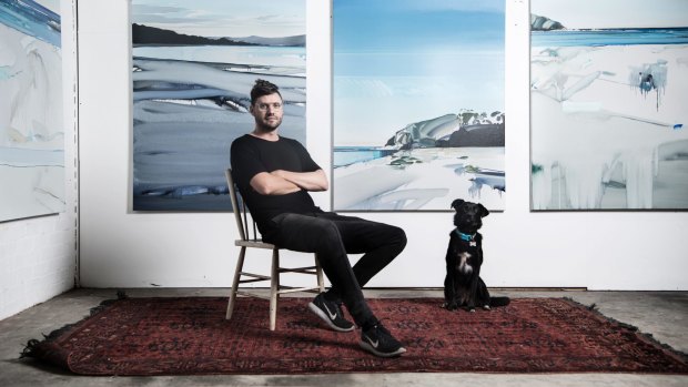 Artist Julian Meagher, here in his studio in Marrickville with dog Lucy, will be exhibiting on the south coast.