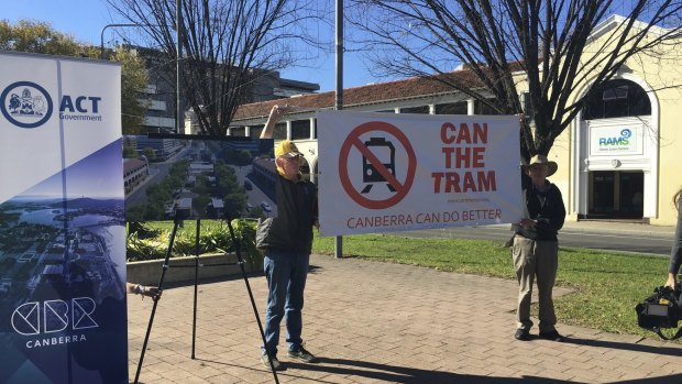 Members of Can the Tram make their views clear as they disrupt the government's light rail announcement.