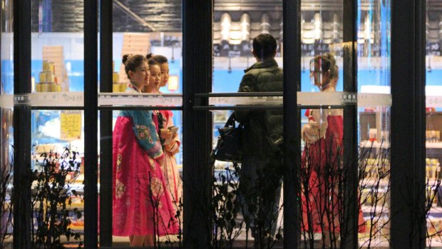 North Korean waitresses at a resaurant in Dandong, China.