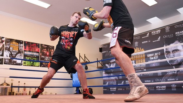 Jeff Horn (left) trains with Glenn Ruston during a training session in Brisbane, on Monday.