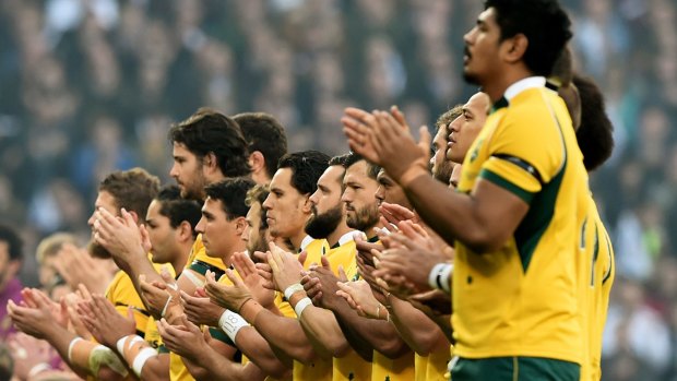 The Wallabies join in the applause in memory of Australian Test cricketer Phillip Hughes.
