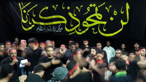 Saudi Shiite men take part in the rites of Ashura in the Eastern Province city of Qatif.