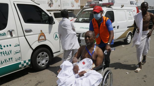 A rescue worker attends to a man injured in the stampede in Mina, Saudi Arabia.