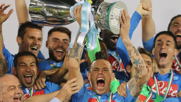 Silver service: Napoli celebrate with the trophy.