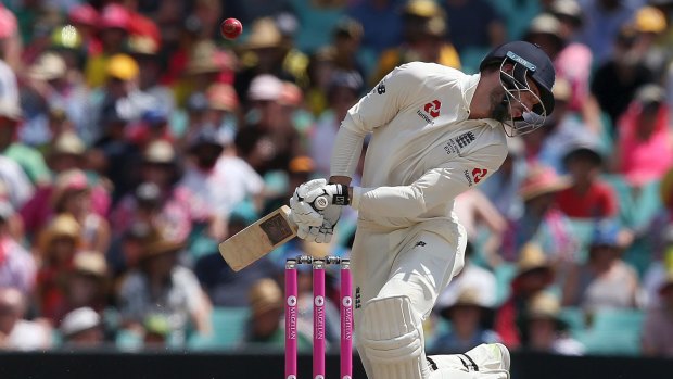 Pressure cooker: The ball glances off the shoulder of England's James Vince from a delivery by Australia's Josh Hazlewood during the final Ashes Test in Sydney.