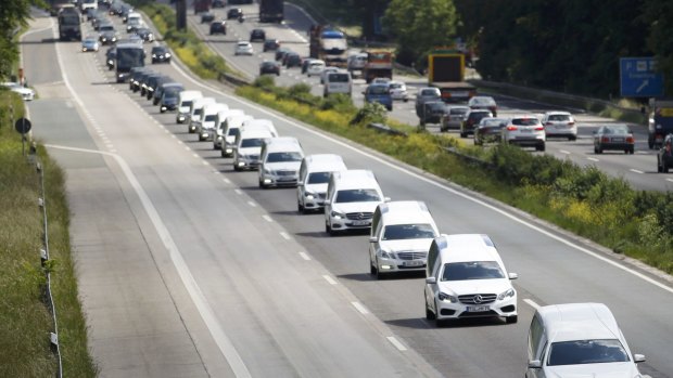 Hearses carrying coffins with remains of victims of the Germanwings flight 4U 9525 on highway A52 on their way to Haltern, Germany.