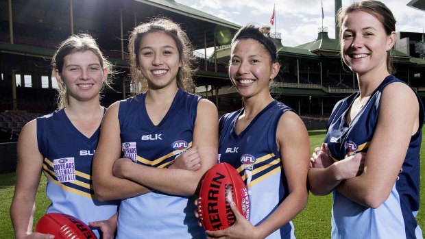 Things have moved on: Rebecca Beeson, Maddy Beeson, Mai Ngyuyen and Nicola Barr from NSW AFL get ready for the first women's AFL game between NSW and Queensland on July 17.