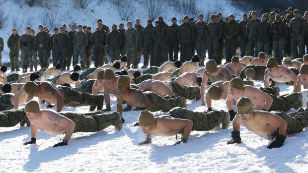 South Korean and US Marines from 3-Marine Expeditionary Force from Okinawa, Japan, do push-ups during their joint military winter exercise in Pyeongchang, South Korea. North Korea wants what it calls "invasion exercises" to stop.