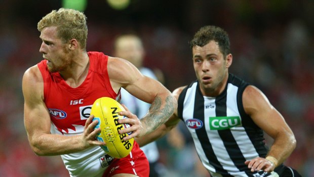 Little brother: Zak Jones takes on Collingwood at the SCG.