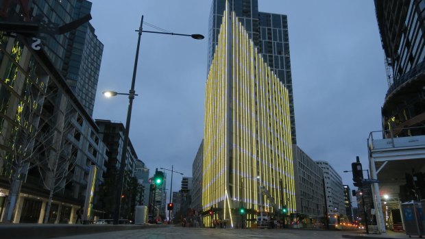 Technicians test the new lighting installation at 888 Collins, Docklands. 