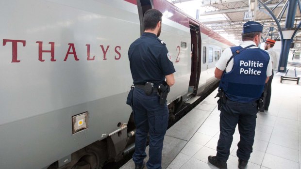 Belgian and French police next to a Thalys train at the Brussels Midi-Zuid train station. Security has become more visible after the attack on a Thalys train travelling from Amsterdam to Paris.  