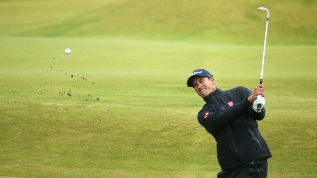 No redemption ... Adam Scott plays out of a bunker on the 14th hole during the final round.