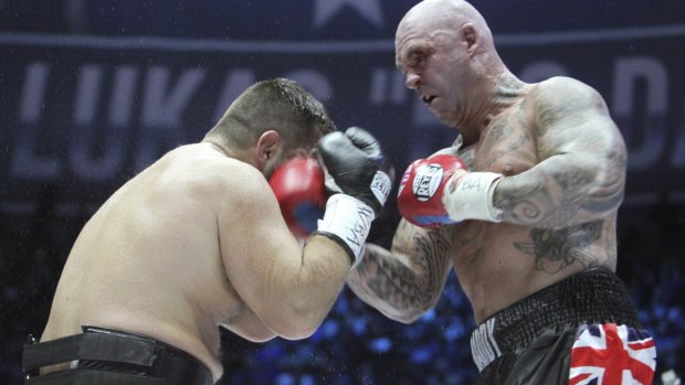 New champ: Australia's Lucas Browne batters Ruslan Chagaev on his way to victory in the WBA world heavyweight clash on Saturday.