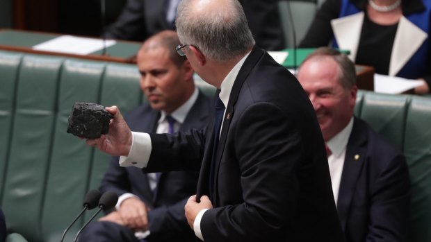 Treasurer Scott Morrison with a lump of coal during question time. 