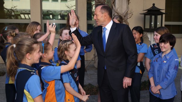 Prime Minister Tony Abbott with Girl Guides at Parliament House in Canberra on Monday September 14, 2015.