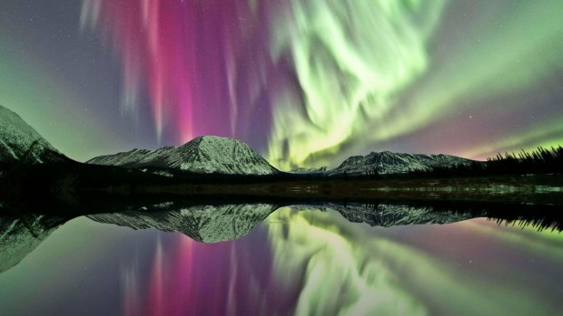 A reflection of northern lights over Annie Lake, Yukon.