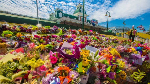 Flower tributes were left at Dreamworld following the October tragedy,