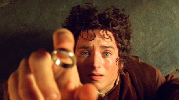 Elijah Wood's character Frodo reaches for the "One Ring", in the film the Fellowship of the Ring.