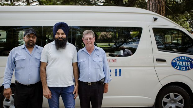Queanbeyan Taxis drivers Amarpreet Singh, Ranjeet Singh, and Tony Ward will eye the impact of Uber on their business after the ride sharing app was legalised in NSW last week. 