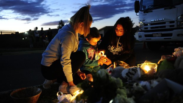 Neighbours light candles for Bradyn Dillon, who was allegedly killed by his father last year.