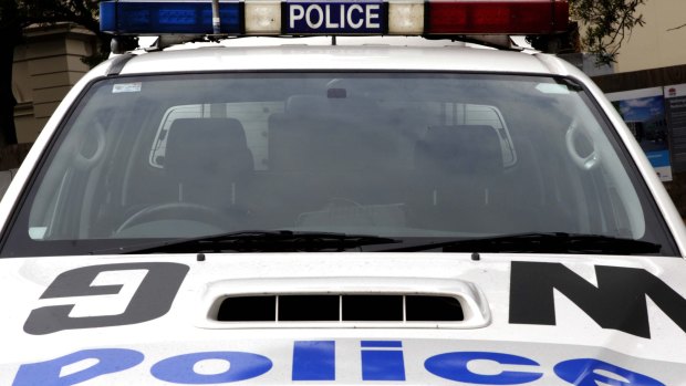 Police stormed a home in Guildford after a man allegedly threatened police with a knife.