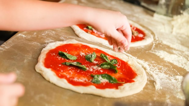 In which Italian city did pizza originate?