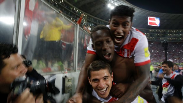 Peru's players celebrate after the final whistle.