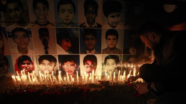 A candlelight vigil is held in Lahore for the 134 children killed in the school attack.