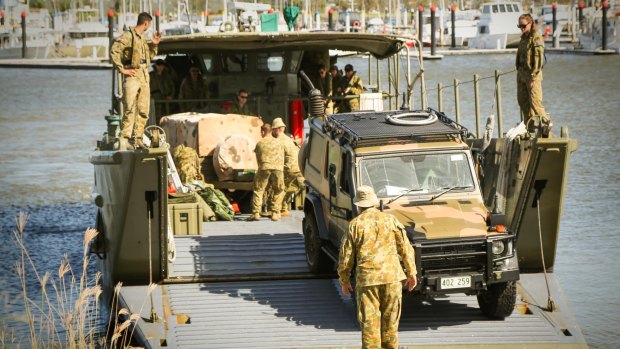 An Australian Army Mercedes Benz G-Wagon disembarks landing craft at the Keppel Bay Marina, Yeppoon, Central Queensland, bound for Rockhampton.
