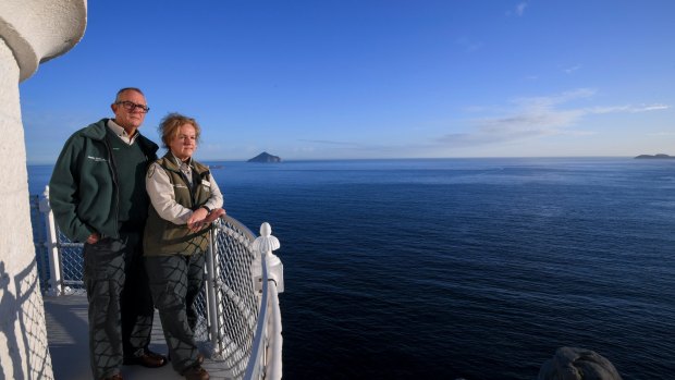 We work here: Colin and Renata Musson watch for whales in Bass Strait from atop the 158-year-old Wilson Promontory Lighthouse. 