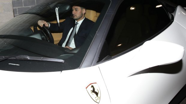 Auburn deputy mayor Salim Mehajer leaves an Auburn council meeting in his white Ferrari. 