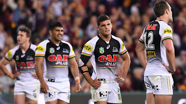 Down and out: Penrith players after the siren.