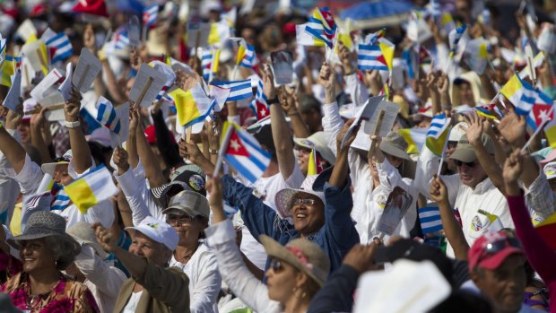 Thousands greet Pope Francis as he arrives to celebrate Mass at the Plaza of the Revolution in Holguin