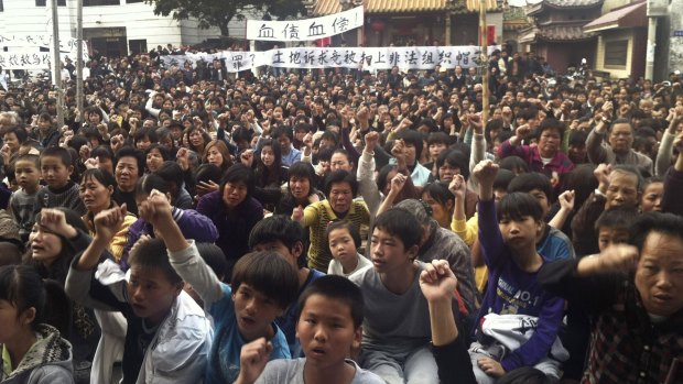 Villagers protest in Wukan village in 2011.